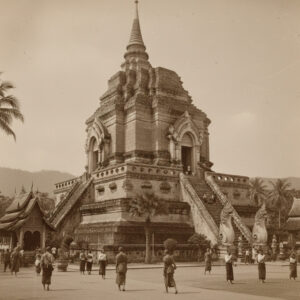 Ancient Wat Chedi Luang temple in Chiang Mai. Chiang Mai heritage site with monks and tourists.