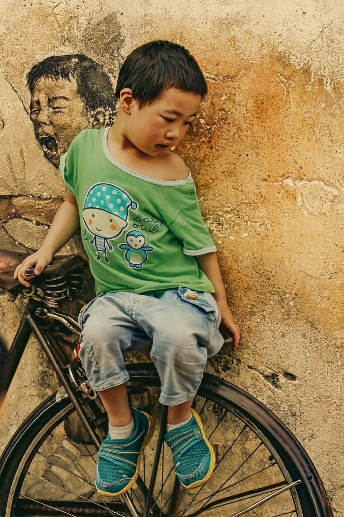 Street Art Boy On Bicycle