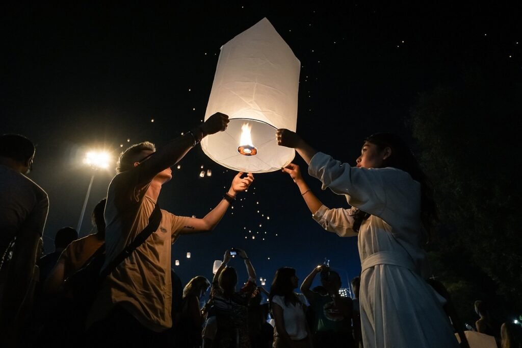 Lanterns Being Released Into Sky At Night 