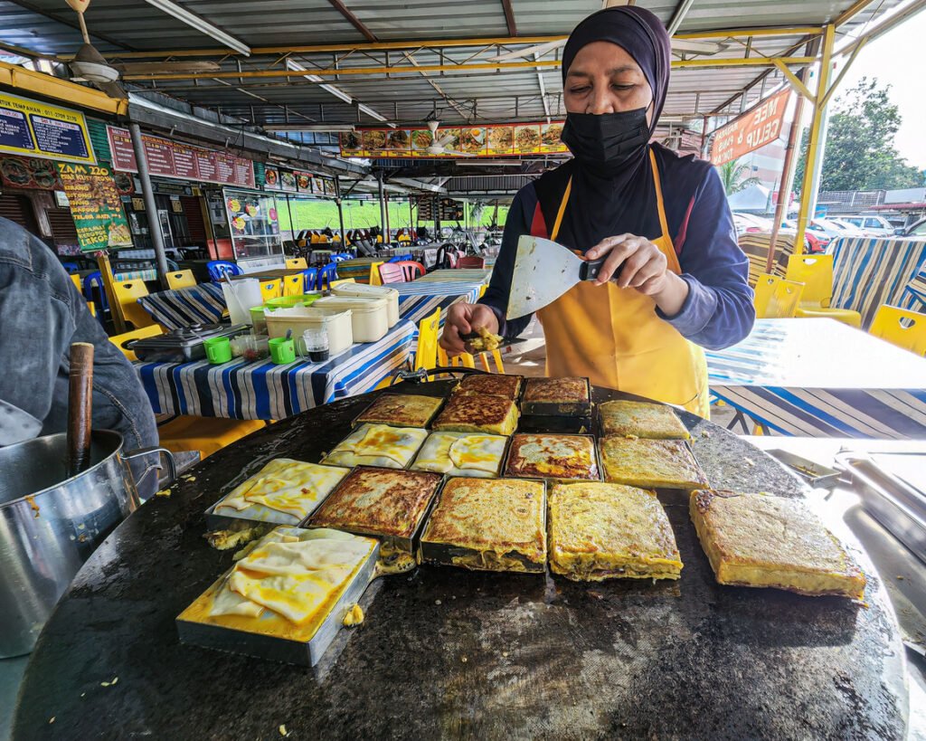 Murtabak Being Cooked On Hot Plate