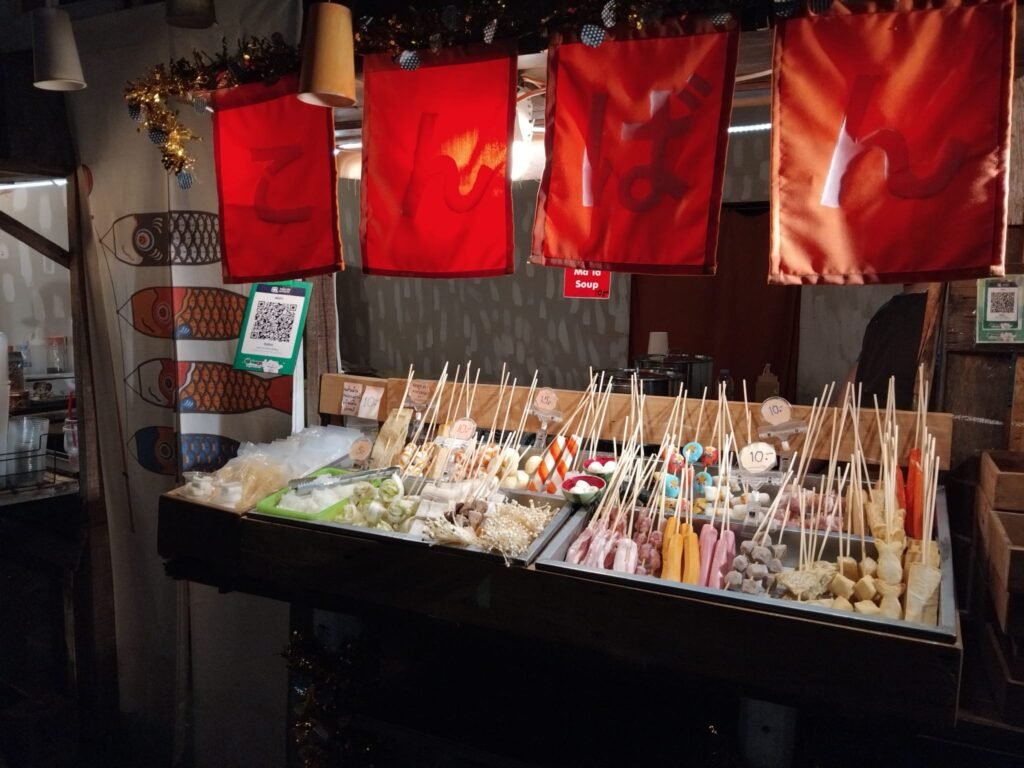 Various Thai Savoury Snacks On Skewers For Sale