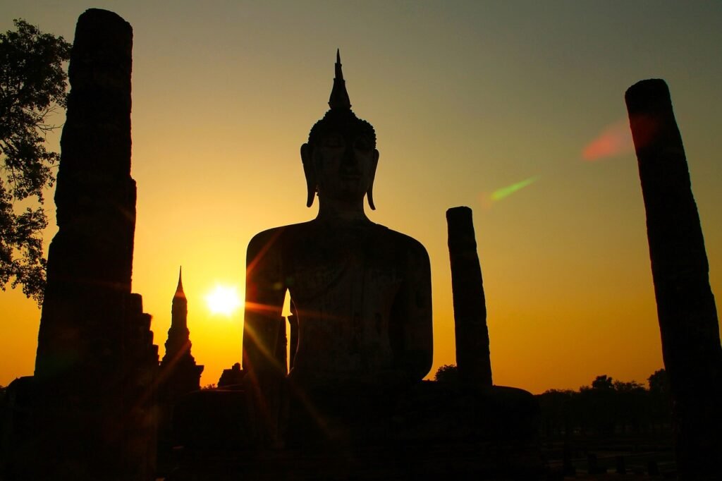 Large Buddha Statue As Sunsets In Sukothai