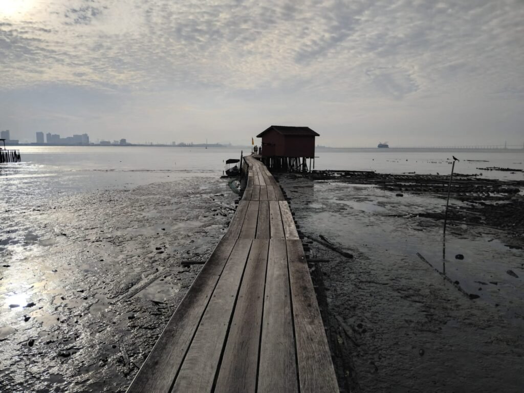 Wooden Pier At Low Tide On The Tan Jetty