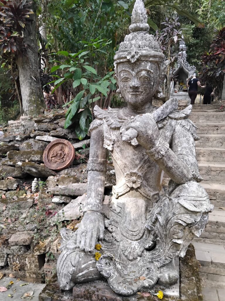 Stone Statue Guarding Temple Grounds