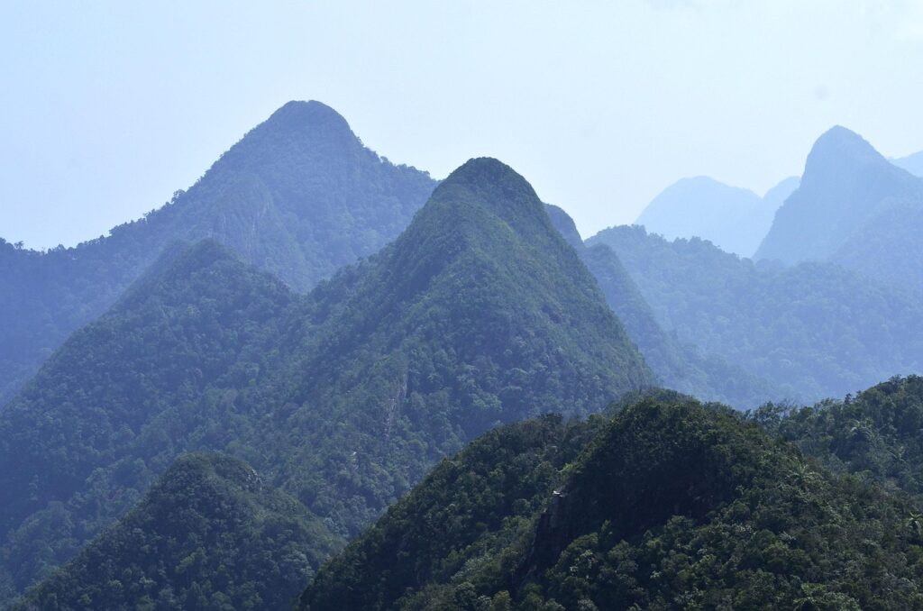 Langkawi mountains covered in lush green vegetation, showcasing the island's history.