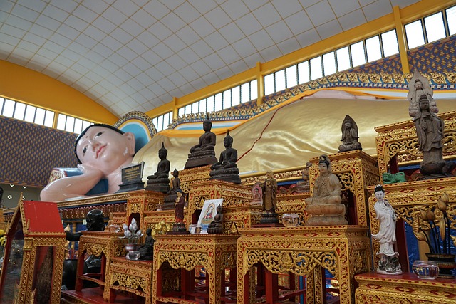 Wat Phra Lat Hike Monks Trail entrance with stone statues guarding the stairs to the temple in Chiang Mai, Thailand.