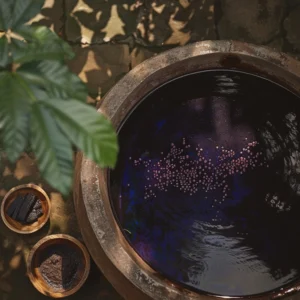 Lanna indigo fermentation vat with small pink bubbles and ingredients